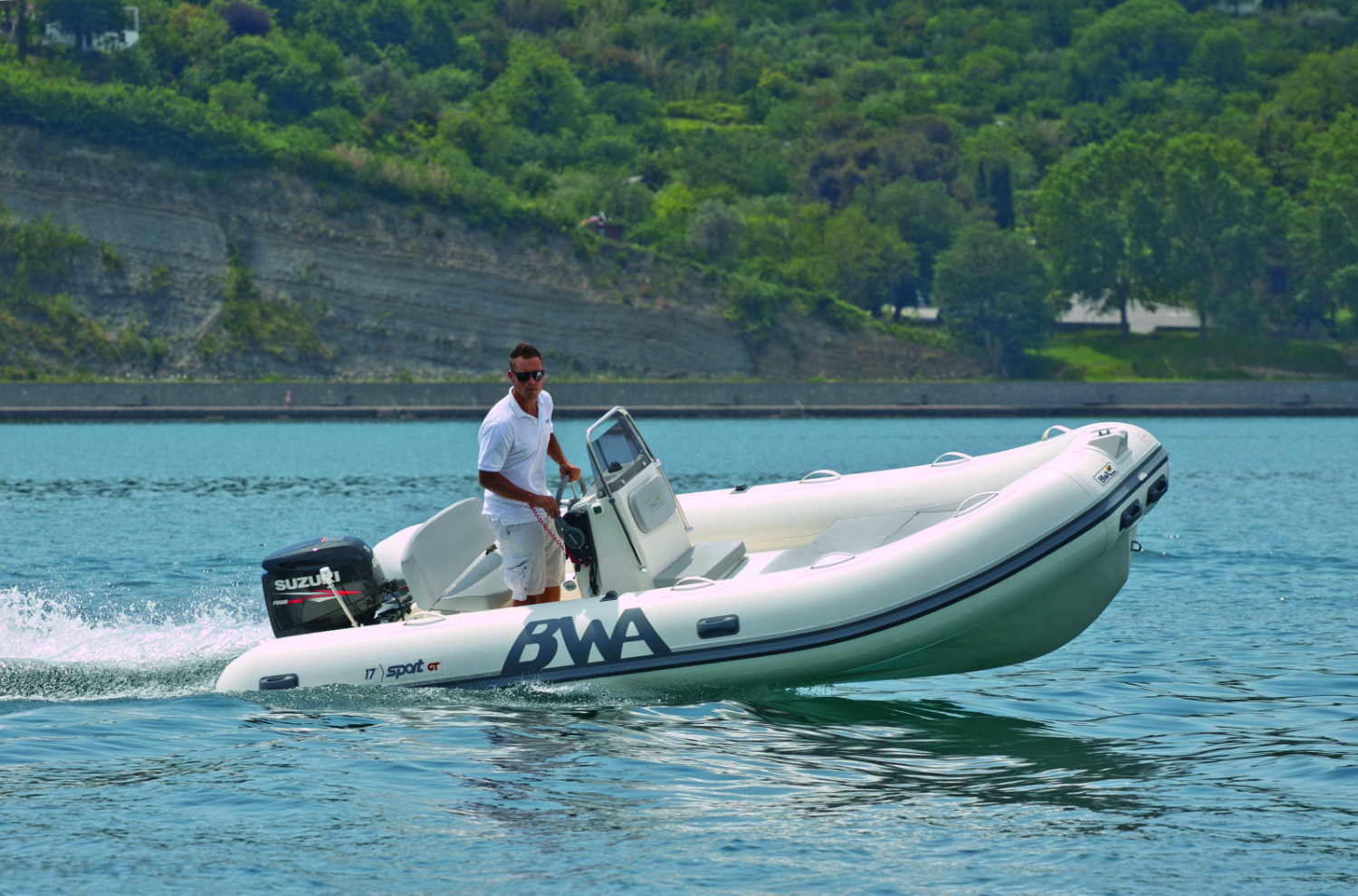 a man in a boat on water BWA 17 GT