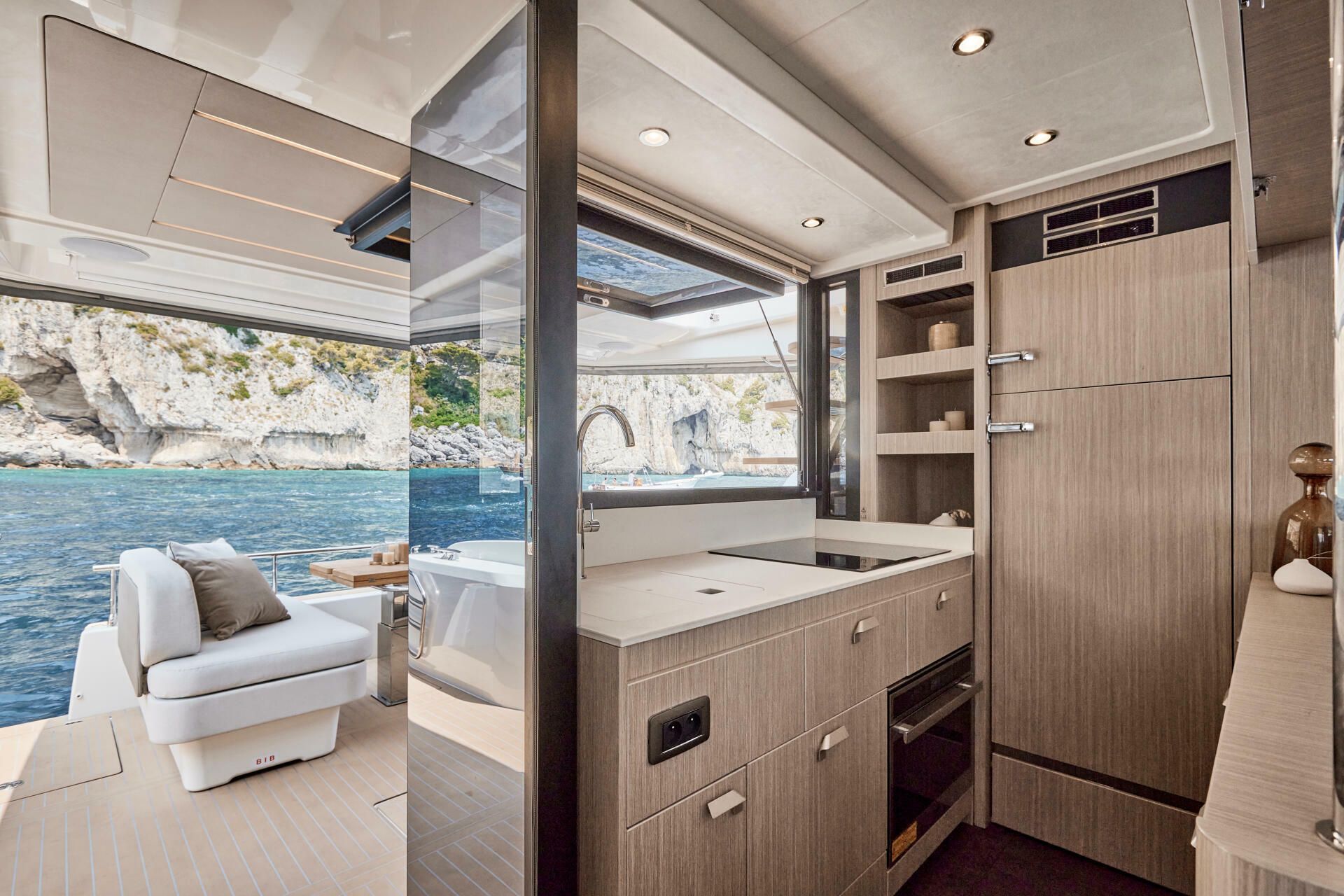 Jeanneau-Yacht-Prestige-F4.9-marseille-yacht-mediterranee00010 a room with a bed and a couch on the water on yacht Prestige F4.9 Marseille