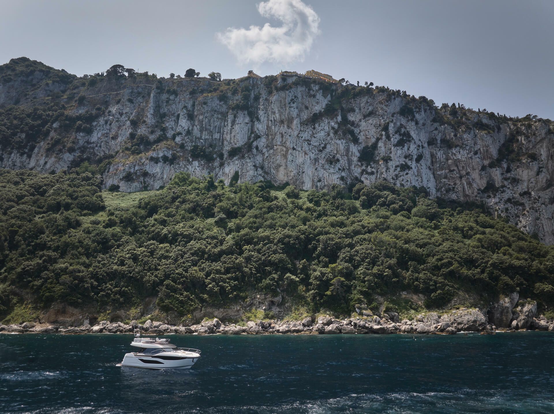 Jeanneau-Yacht-Prestige-F4.9-marseille-yacht-mediterranee00026 a boat in the water with trees on the side yacht Prestige F4.9 Marseille