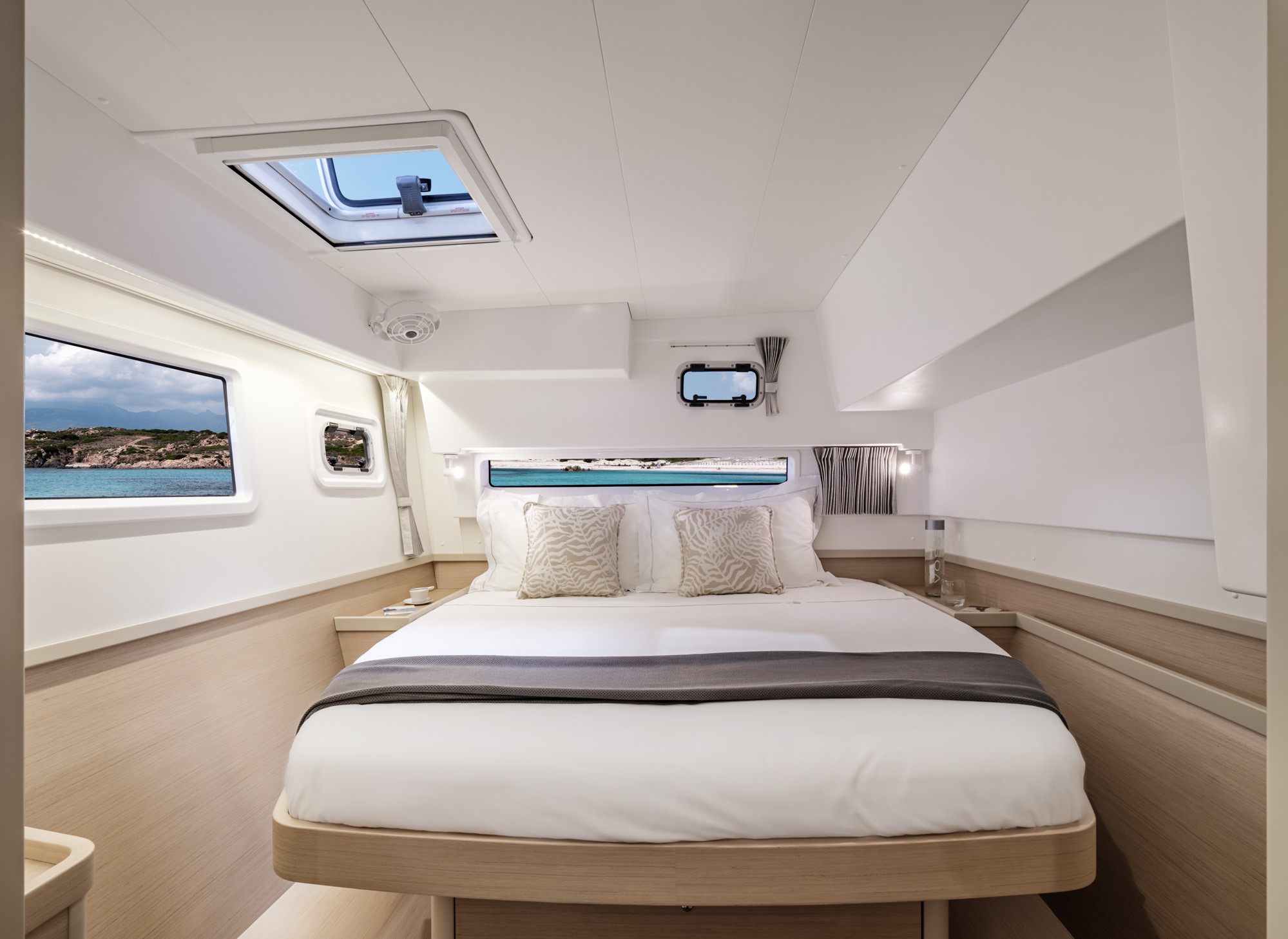 Catamaran-lagoon-Yacht-Méditerranee-Marseille-00004 a room with a bed and a book shelf